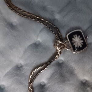 Tare Brighton Lilly necklace on blue. ***will trade***